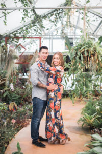 floral dress engagement session in greenhouse