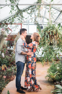 floral dress engagement session in greenhouse