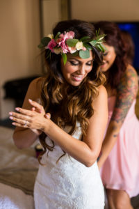 bride with flower crown getting ready