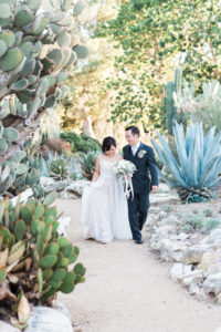 bride and groom in cactus garden
