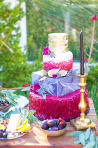 colorful wedding cake with marble and fresh figs