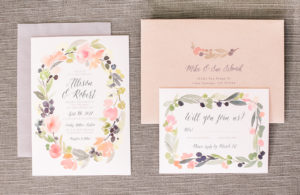 invitation suite with soft pinks, greens and ivory