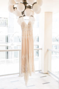 lace bohemian wedding dress on hanger