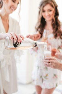 champagne with bridesmaids in rompers