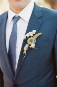 groom and dried flowers boutonniere