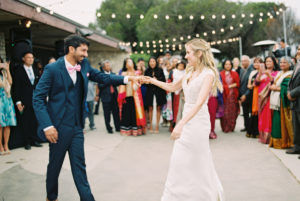 bride and groom dance under bistro lights point vicente