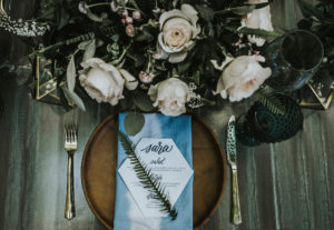 moody indigo wedding with wooden plates