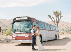 rimrock ranch desert wedding couple in front of vintage bus