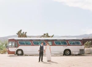 bride and groom at rimrock ranch vintage bus