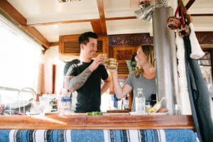 margarita cheers in boat galley kitchen liveaboard