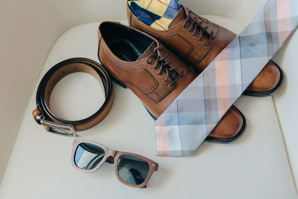 groom's brown shoes brown sunglasses brown belt and pattern tie