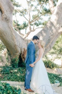 bride and groom under tree at south coast botanic garden for first look