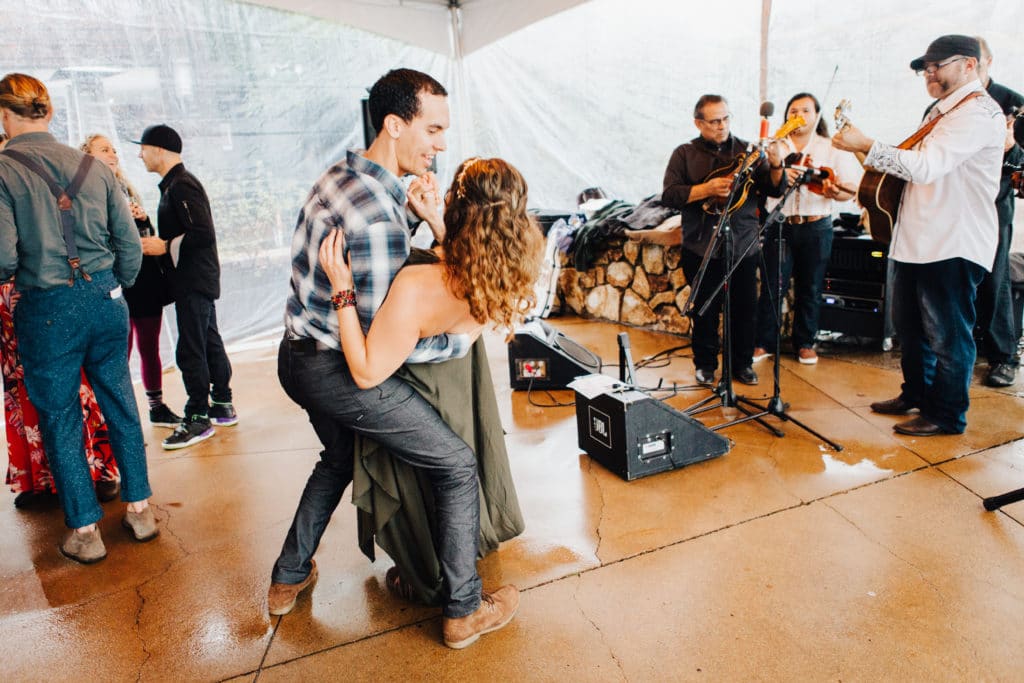 wedding guests dancing under clear tent wedding ventana inn