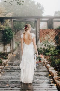 open back bridal gown and bright bouquet at Ventana Inn wedding