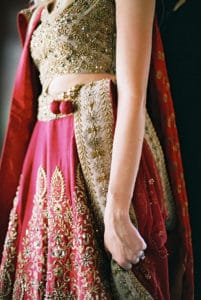 bride in red and gold traditional lehenga