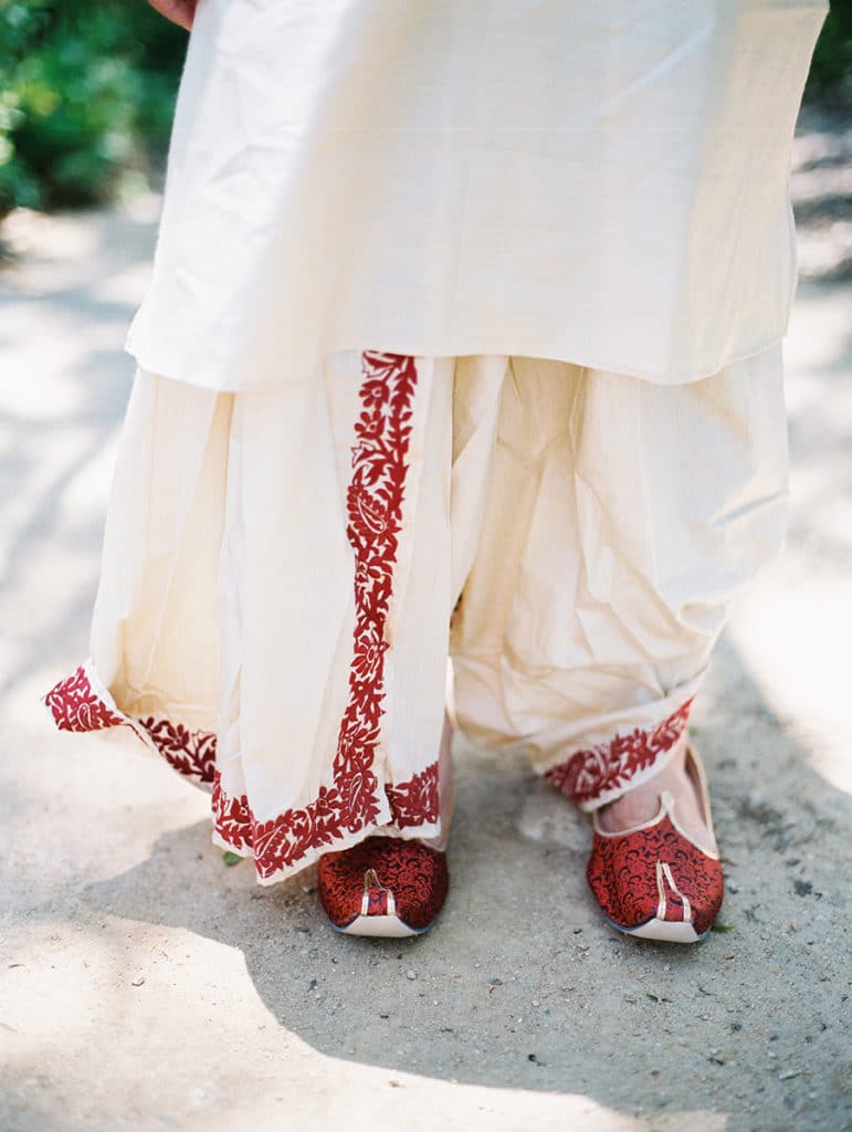traditional indian groom wedding outfit red and white