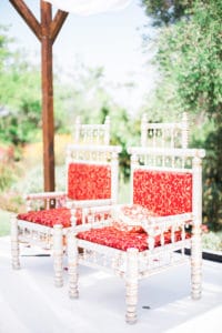 hindu ceremony chairs red and white under mandap at south coast botanic garden