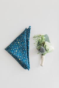 Blue handkerchief with white and green boutonniere for Groom