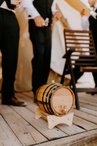 Mini whiskey barrel for the groomsmen at desert wedding Moab Under Canvas