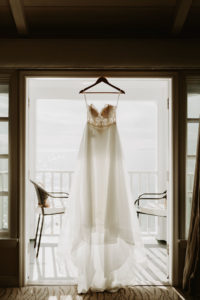 Hanging wedding dress with ocean view for Laguna Beach Elopement