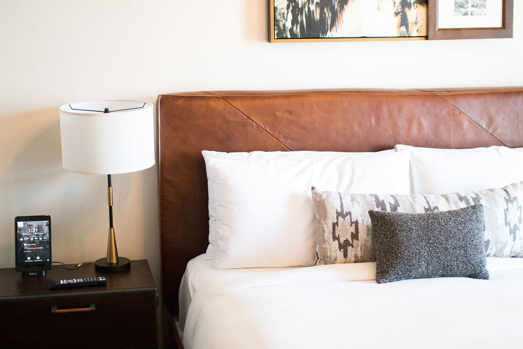 Bedroom Suite with leather headboard. Boutique Hotel in Downtown Los Angeles, Hotel Figueroa is the perfect wedding venue for the modern bride or corporate event space for trendy companies