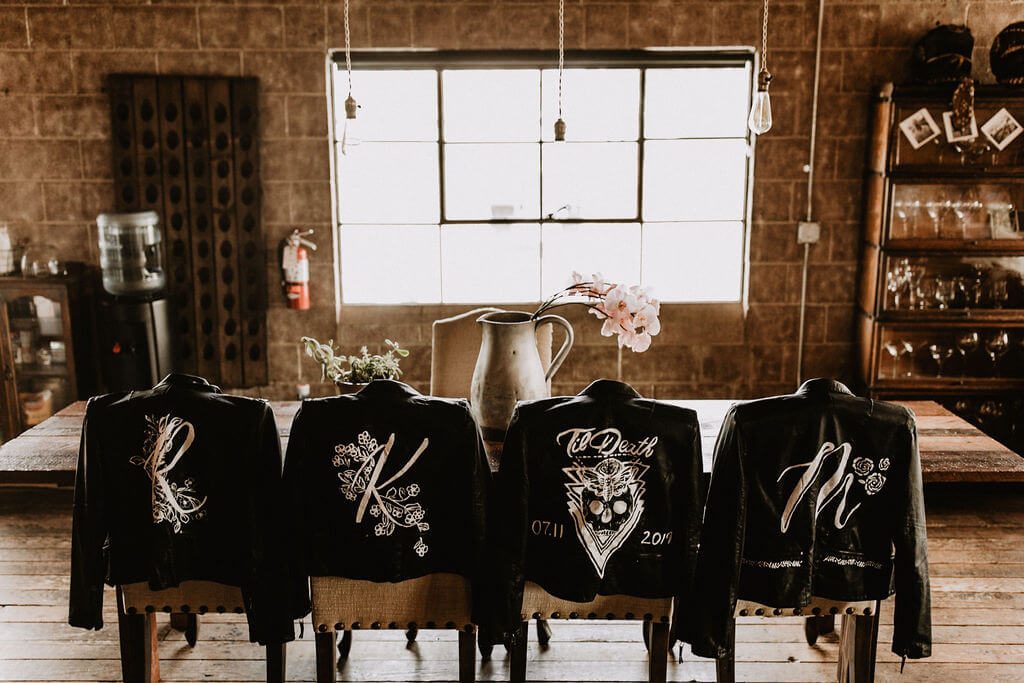 Painted leather jackets for bride and bridesmaids at wedding at Smoky Hollow Studios