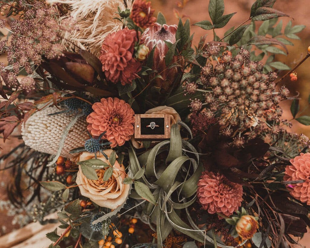 Fall moody bouquet with black diamond engagement ring