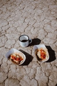Breakfast tacos served up to guests for a remote desert wedding inspired by a music festival.