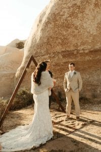 Intimate ceremony with triangle arch in Joshua Tree