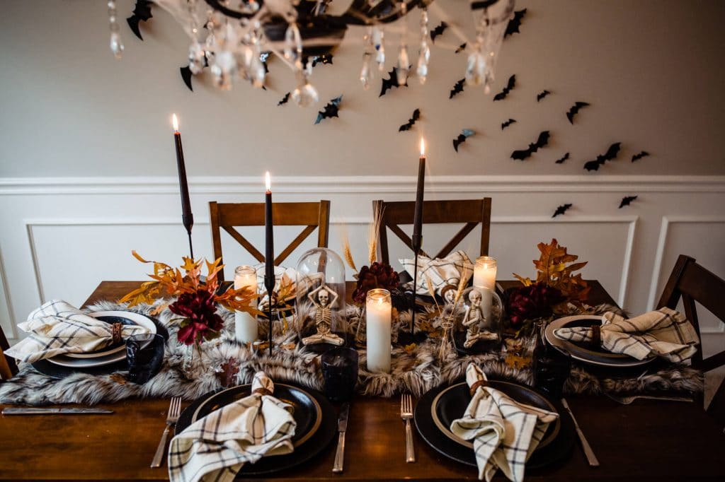 Halloween table decorations with bats on the wall