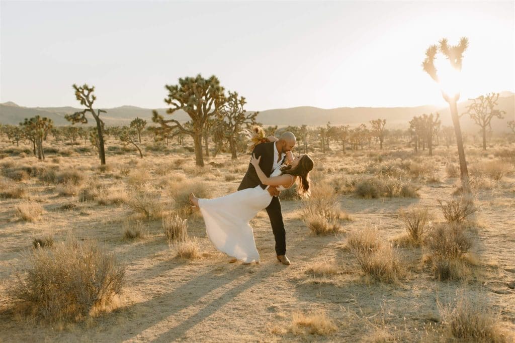 Bride and Groom posing in the desert