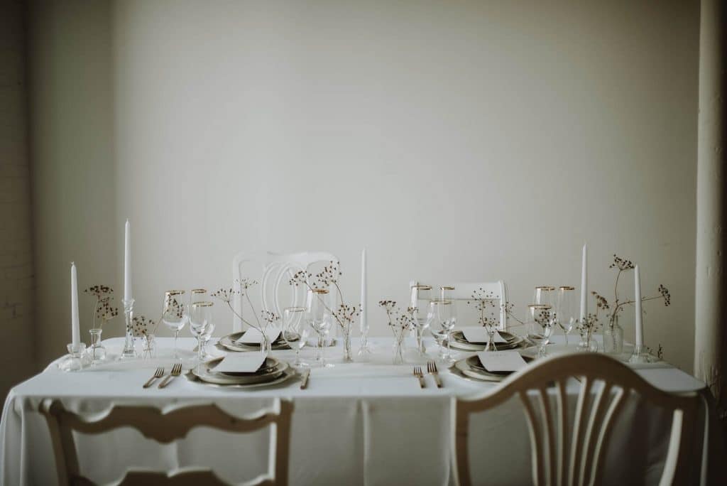Minimal Halloween wedding table decor with white and gold details